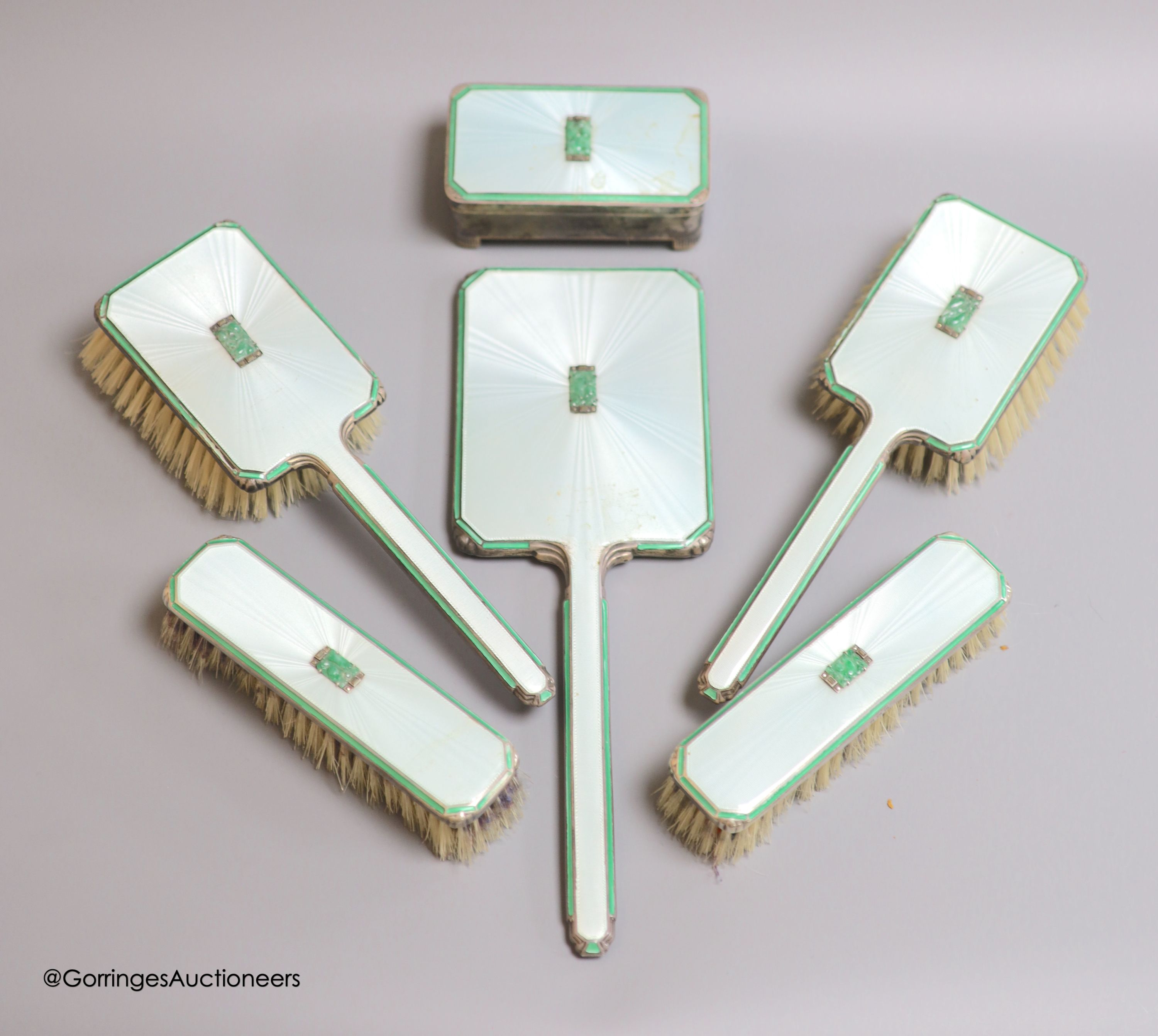 A 1930's Art Deco six-piece silver, enamel, marcasite and jade set dressing set, including a rectangular trinket box(a.f.) 10.5cm, Adie Brothers, Birmingham, 1936.